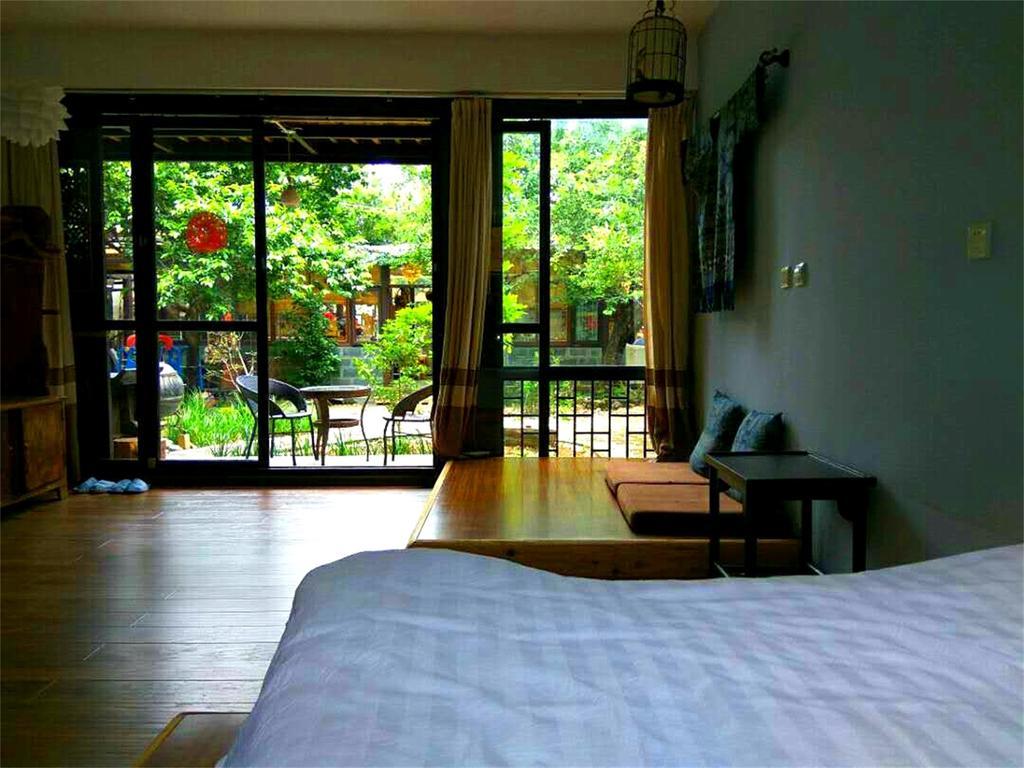 Lijiang Baisha Free Time Designed Hotel Exterior photo